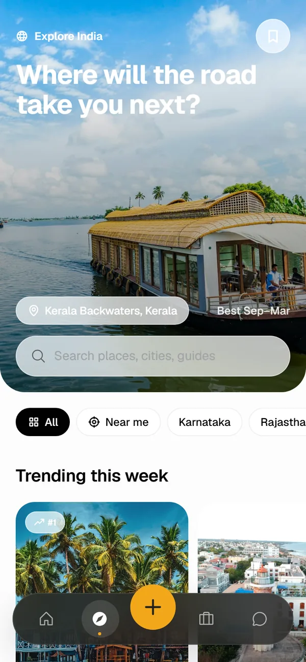 Explore screen with a houseboat on the Kerala backwaters, a search bar, region filters and trending places this week.